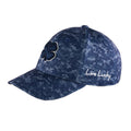 A blue camouflage baseball cap features an embroidered four-leaf clover logo and the words Live Lucky stitched on the side, designed for casual outdoor wear.