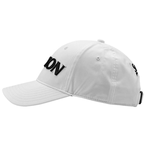 A white baseball cap displays the word "DION" in bold black letters on the front while resting flat on a surface emphasizing its casual design in a plain background.