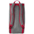 A gray backpack with red straps stands upright featuring a top handle and logo on the sides indicating a sporty design suitable for carrying sports equipment or school materials.