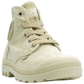 A light beige high-top shoe features laces and a textured sole positioned slightly forward likely ready for wear on a flat surface or ground.