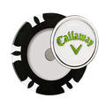 A round golf ball marker featuring a black border and a white center displays the word "Callaway" in green with a check mark icon situated in the middle on a white background.