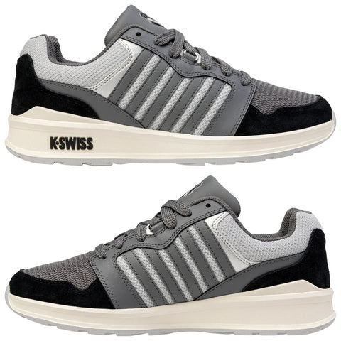 A pair of gray athletic shoes features mesh and suede material with three stripe accents and a white sole positioned against a plain background showcasing their design and color scheme.