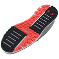 A shoe sole featuring a mix of red and black rubber with a patterned grip surface designed for traction while in motion on various terrains.