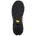 A black rubber shoe sole with deep treads is positioned flat against a light background highlighting its textured grip pattern and a yellow Vibram logo near the center.