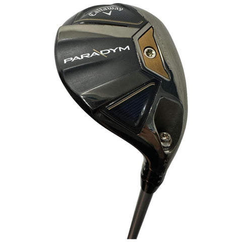 A golf club head designed for performance is angled for use with a graphite shaft visible below it showcasing a Callaway branding and the model name Paradym on its side.