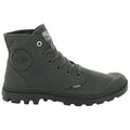 A dark green high-top boot with a rubber toe cap is positioned upright showcasing its laces and textured material designed for outdoor wear featuring the brand logo on the side.