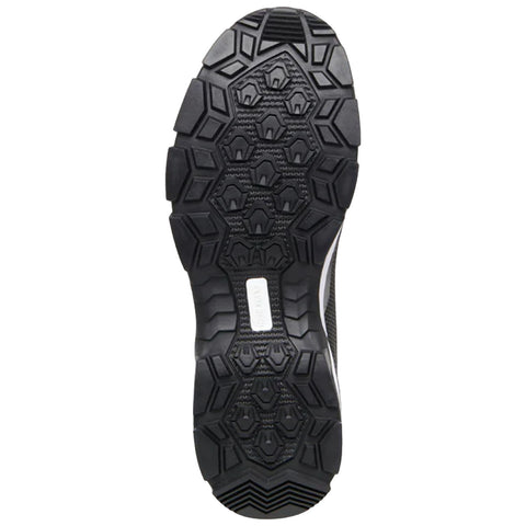 A black shoe sole with a textured pattern is positioned upright focusing on its grip features showcasing multiple hexagonal shapes designed for traction on various surfaces.