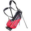 A red and black golf bag stands upright with extended legs featuring a harness system for shoulder carrying showcasing several zippered pockets and a sleek design for organizing golf equipment.