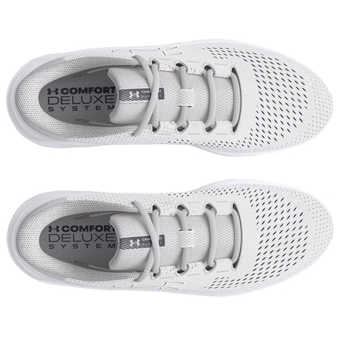 A pair of light gray athletic shoes rests flat with a breathable mesh upper and laces. The insoles display the text COMFORT DELUXE SYSTEM. The background is plain.