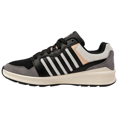 A black and gray athletic shoe with white stripes sits horizontally showcasing a mesh and suede finish designed for comfort and style in a casual or sports setting.