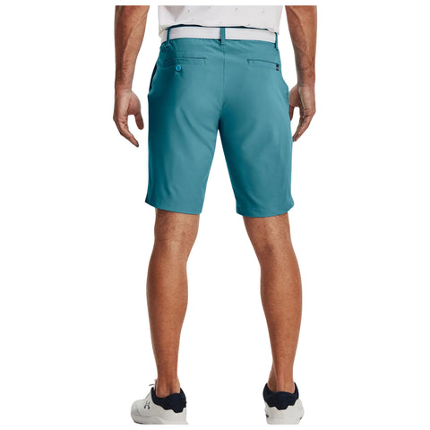 Turquoise shorts are worn by a person standing upright with their back to the viewer revealing a smooth fabric and a casual style in a neutral setting.