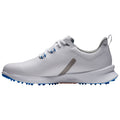 A white athletic shoe features a smooth surface and textured accents The shoe is positioned on a plain background highlighting its design details including blue spikes on the sole