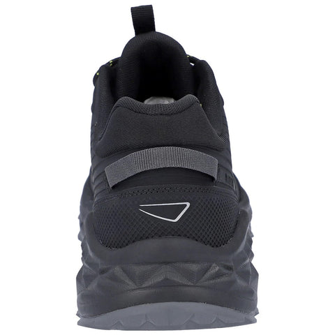 Black athletic shoe is positioned upright showcasing its back with a looped pull tab and textured surface highlighting its structural design and grip pattern for traction on various surfaces