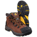 Brown hiking boots are positioned to show sides and soles featuring steel midsoles and rugged treads designed for traction in outdoor environments