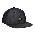 A black snapback cap features a round logo with a four-leaf clover and the text BLACK CLOVER LIVE LUCKY positioned at the front displayed against a textured fabric background.