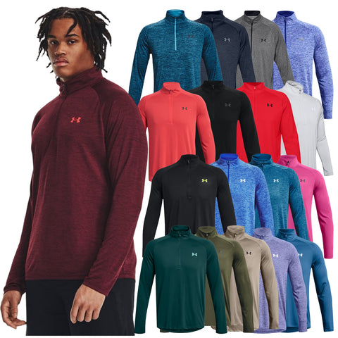 A young man in a red athletic shirt poses while various long-sleeve shirts in multiple colors hang next to him showcasing a range of styles from the same brand.