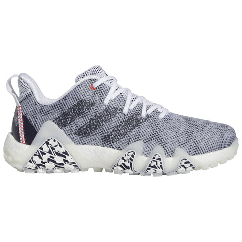 A gray athletic shoe with a textured upper laces up while featuring a distinctive patterned sole providing grip designed for performance in sports or casual wear against a plain background.