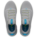 Gray athletic shoes are positioned on a flat surface laces are threaded through eyelets and the tongue features a blue tab with branding the interior shows contrasting colors and logo.