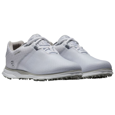 A pair of white golf shoes sits side by side featuring a sleek design with textured surfaces and cleated soles suitable for traction on the golf course.