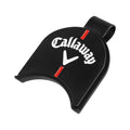 A black golf tee marker is positioned upright displaying the Callaway logo in white with a red vertical line beneath it set against a plain light background.