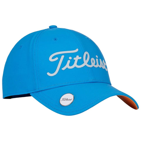 A bright blue baseball cap features a white cursive logo reading Titleist on the front while an orange underside of the brim adds contrast in a casual accessory setting.