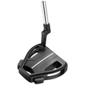 A black golf putter head rests on a flat surface showcasing a sleek design with a metallic shaft attached marking its readiness for use in a golf game.