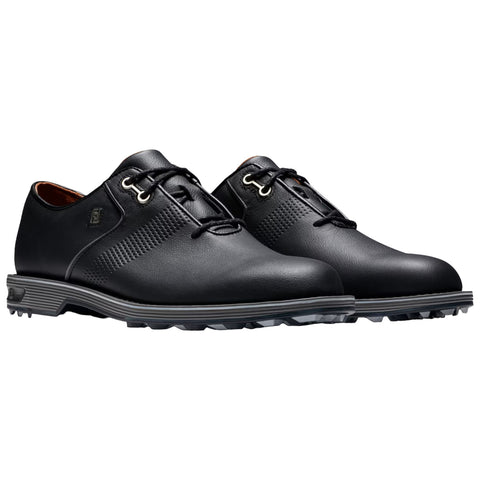 A pair of black golf shoes with a smooth leather finish features lace-up closures and a patterned side design situated on a plain white background.