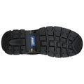 A black rubber shoe sole features deep treads for traction and stability ensuring slip resistance designed for outdoor or work environments providing safety and durability.