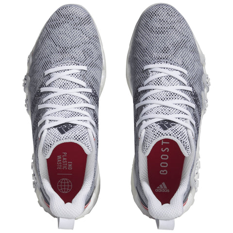 Two athletic shoes with a gray mesh upper and white soles are positioned upright side by side showcasing laces and inner labels that read "END PLASTIC WASTE" and "BOOST" along with the Adidas logo.