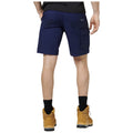 Blue cargo shorts are worn by a person standing with their back to the viewer. They wear brown boots and black socks, set against a white background.