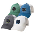 Four caps displayed in various colors including green blue gray and white feature a four-leaf clover emblem on the front showcasing both casual style and luck in a neutral background.