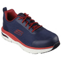 A navy blue sneaker with red accents sits on a white background. The shoe features a padded interior and laces, designed for comfort and support during activities.