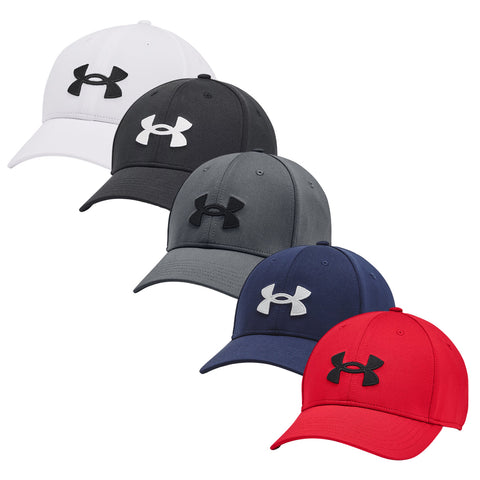 Five baseball caps are displayed in a row with varying colors including white black grey navy and red each featuring the Under Armour logo prominently on the front