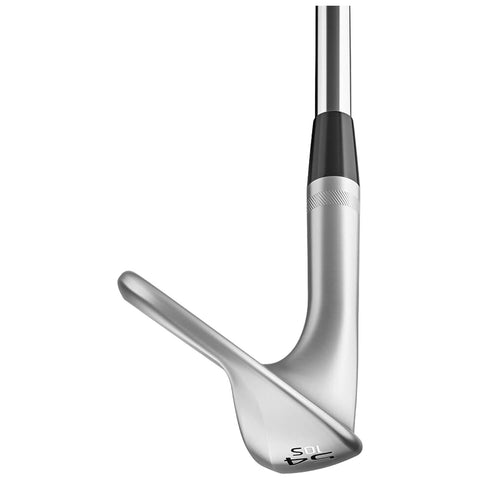 A golf club lies horizontally showcasing its polished silver head and black grip while positioned for a shot on a golf course or practice area highlighting its elegant design and functionality.