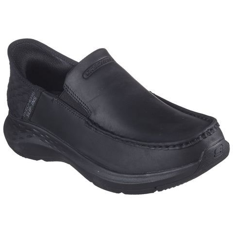 A black slip-on shoe features a smooth leather upper with elastic side panels for easy wear designed for comfort with a thick cushioned sole suitable for casual or work settings.