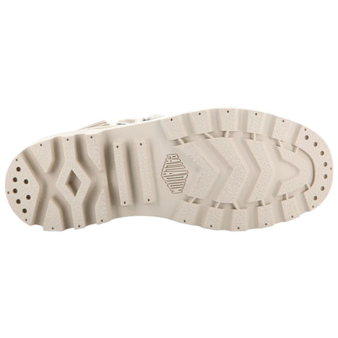 A shoe's bottom is shown featuring a textured rubber sole with various patterns and grips visible indicating a design suited for traction in outdoor environments.