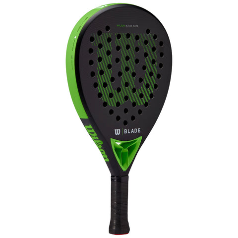 A black paddle with a green logo is positioned upright showcasing its perforated hitting surface and textured grip providing a handle for use in paddle sports.