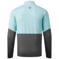 A long-sleeved shirt is positioned upright showcasing a color-block design with a light blue upper half and a dark gray lower half. The context indicates a focus on modern activewear design.