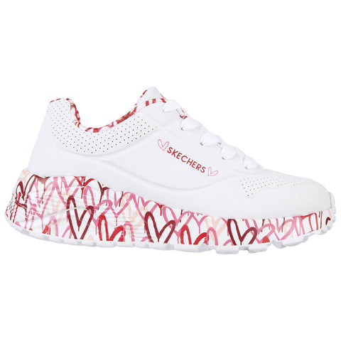 White sneaker with a thick sole featuring multicolored heart patterns and a smooth upper. It has a logo on the side and laces for securing the fit.