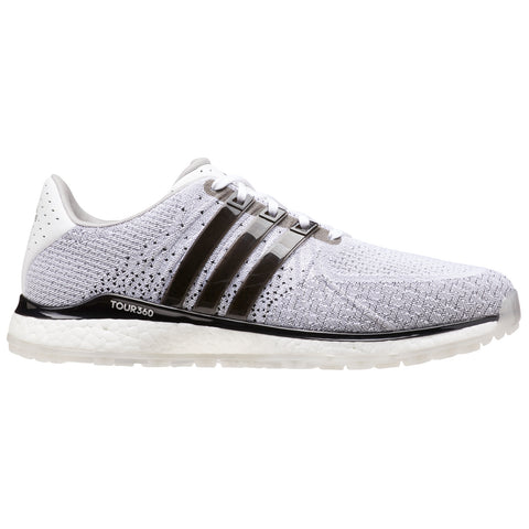 A white and gray athletic shoe with a textured knit upper features three black stripes and a black outsole designed for performance in sports and outdoor activities.