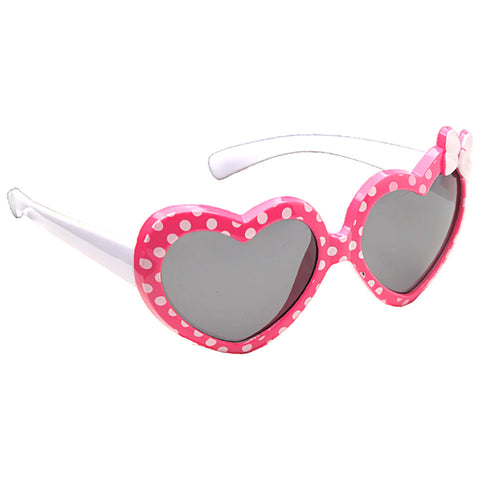 Heart-shaped sunglasses with a pink frame adorned with white polka dots are displayed against a light background showcasing a playful and whimsical accessory typically worn for sun protection.