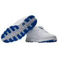 White golf shoes are displayed with a focus on their blue-accented soles showcasing a modern design and technology suitable for performance on the golf course.