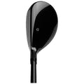 A sleek black golf club head is positioned upright showcasing its glossy surface and patterned grooves aimed at hitting a golf ball on a course or driving range.