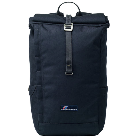 A black backpack stands upright with a rolled top secured by a buckle strap showcasing a logo on the front side. It features side pockets and a top handle for easy carrying.