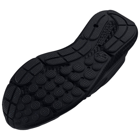 A black shoe sole is displayed with a textured surface featuring various patterns and grips designed for traction and support in walking or running on different terrains.