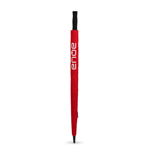 A red umbrella stands upright with a black handle The context is a plain white background emphasizing the umbrella's color and design It features the word aqua in a bold white font