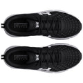 Black athletic shoes are positioned with the tops facing up showcasing a sleek design and perforated upper material with white logo details and text reading COMFORT DELUXE SYSTEM inside the shoes