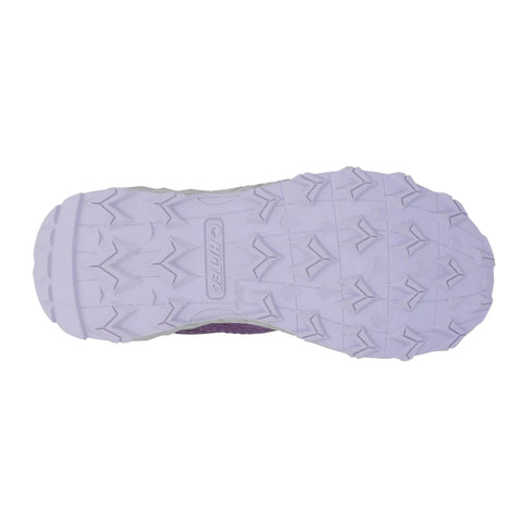 A purple-soled shoe is positioned upside down displaying its textured white rubber outsole featuring zigzag patterns meant for traction on various surfaces.