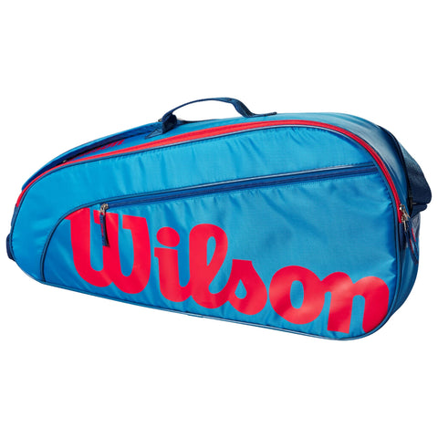 A blue athletic bag features a prominent red "Wilson" logo on the side with zippers for storage and a handle for carrying, typically used for sports equipment.