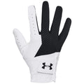 A white and black golf glove is positioned upright with fingers extended showcasing its design and grip texture in a neutral background emphasizing its athletic purpose and style.